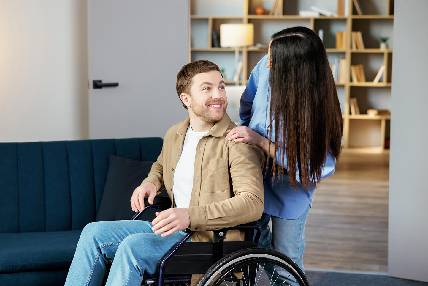 Man in wheelchair with a carer